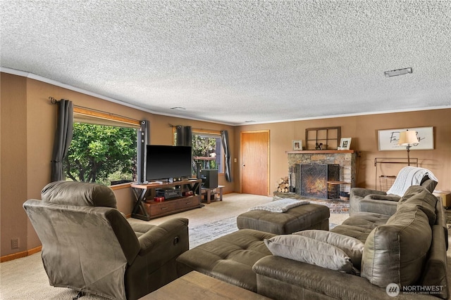1714 N Astor Ct, East Wenatchee, WA 98802 - living area featuring carpet floors, a textured ceiling, a stone fireplace, and crown molding