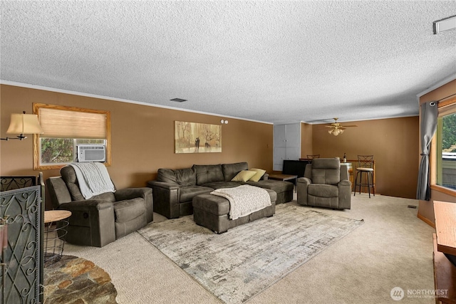 1714 N Astor Ct, East Wenatchee, WA 98802 - carpeted living area with cooling unit, a textured ceiling, a ceiling fan, and ornamental molding