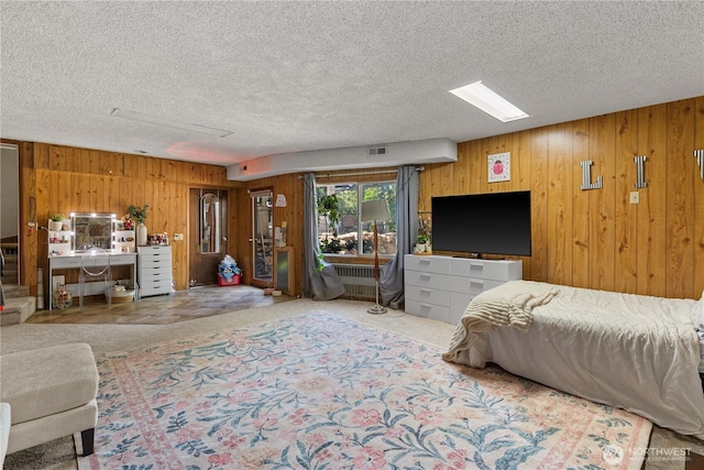 1714 N Astor Ct, East Wenatchee, WA 98802 - carpeted bedroom with wooden walls, a textured ceiling, and radiator heating unit