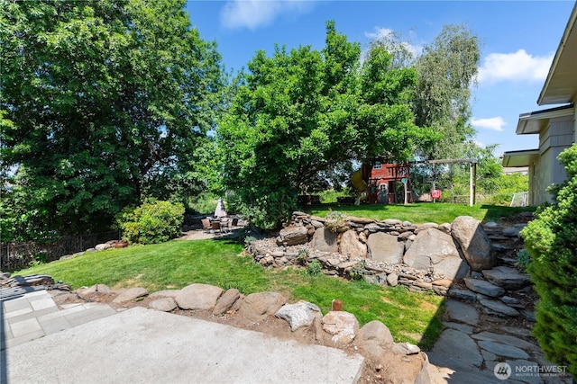 1714 N Astor Ct, East Wenatchee, WA 98802 - view of yard featuring a playground, a patio, and a fire pit
