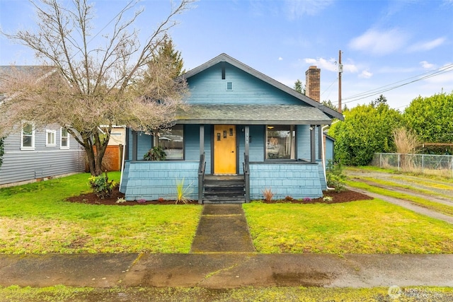 111 Aurora St, Centralia, WA 98531 - bungalow with a chimney, covered porch, and roof with shingles