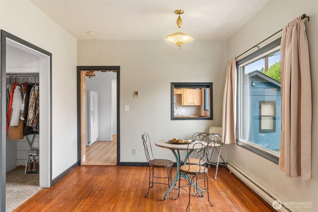111 Aurora St, Centralia, WA 98531 - dining area with a baseboard radiator and wood finished floors
