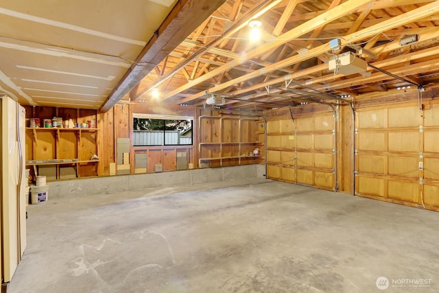 11214 80th Ave NE, Kirkland, WA 98034 - garage featuring freestanding refrigerator and a garage door opener