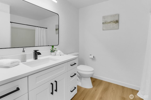 11214 80th Ave NE, Kirkland, WA 98034 - bathroom with vanity, wood finished floors, and a shower with shower curtain