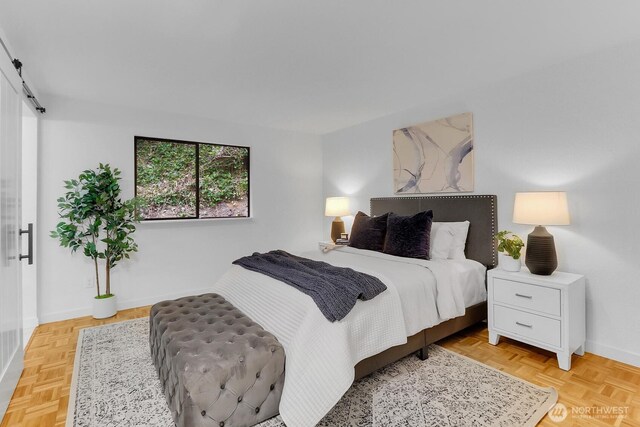 11214 80th Ave NE, Kirkland, WA 98034 - bedroom featuring a barn door and baseboards