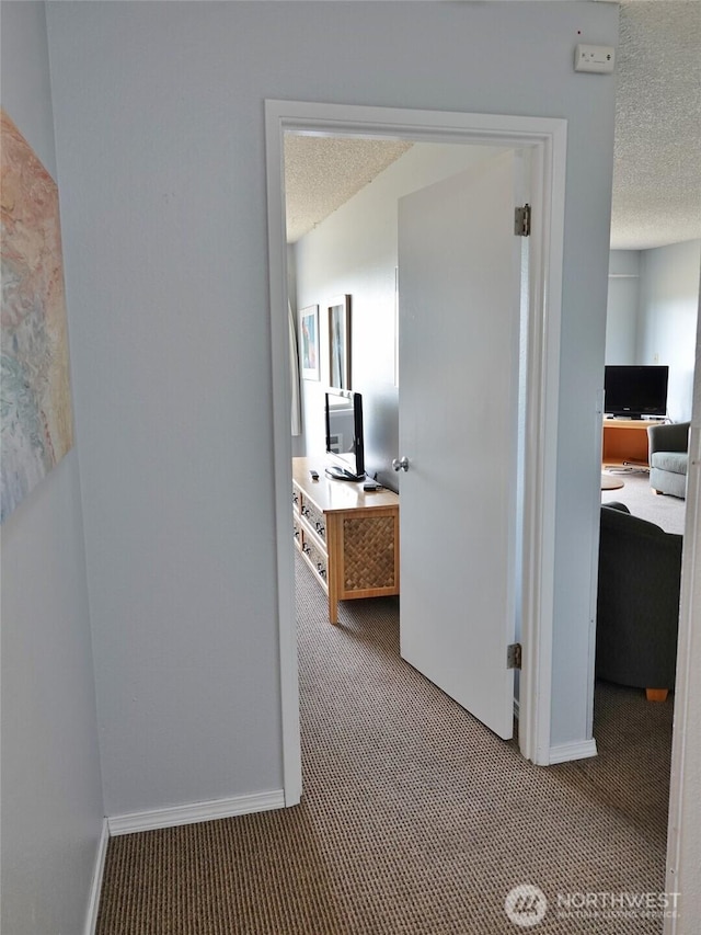 615 Ocean Shores Blvd NW Unit 210, Ocean Shores, WA 98569 - hall with carpet, an office area, and a textured ceiling