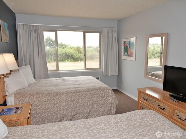 615 Ocean Shores Blvd NW Unit 210, Ocean Shores, WA 98569 - bedroom featuring multiple windows and carpet floors