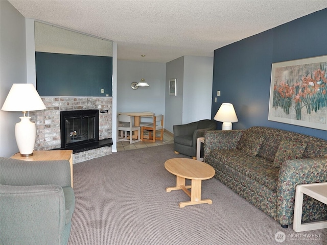 615 Ocean Shores Blvd NW Unit 210, Ocean Shores, WA 98569 - carpeted living room featuring a textured ceiling and a fireplace
