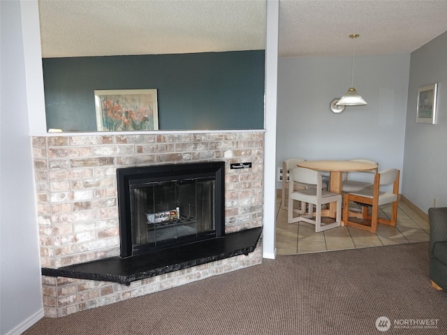 615 Ocean Shores Blvd NW Unit 210, Ocean Shores, WA 98569 - detailed view of carpet floors, a fireplace, and a textured ceiling
