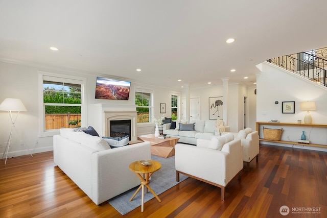 603 9th Ave, Kirkland, WA 98033 - living area featuring wood finished floors, a glass covered fireplace, recessed lighting, stairway, and ornate columns