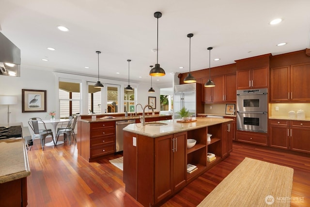 603 9th Ave, Kirkland, WA 98033 - kitchen featuring stainless steel appliances, a kitchen island with sink, dark wood finished floors, crown molding, and recessed lighting