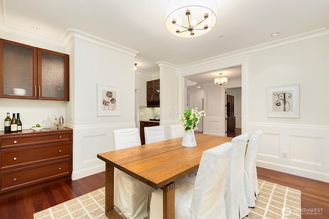 603 9th Ave, Kirkland, WA 98033 - dining space with a chandelier, a decorative wall, dark wood finished floors, ornamental molding, and wainscoting