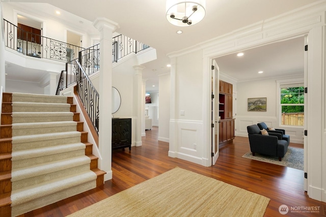 603 9th Ave, Kirkland, WA 98033 - entrance foyer with decorative columns, wood finished floors, stairs, crown molding, and recessed lighting