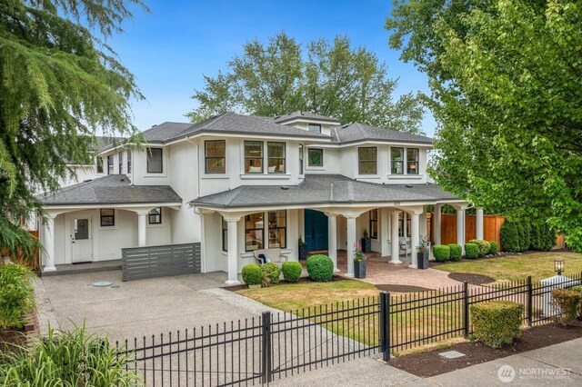 603 9th Ave, Kirkland, WA 98033 - view of front of property featuring a porch, stucco siding, roof with shingles, and a fenced front yard