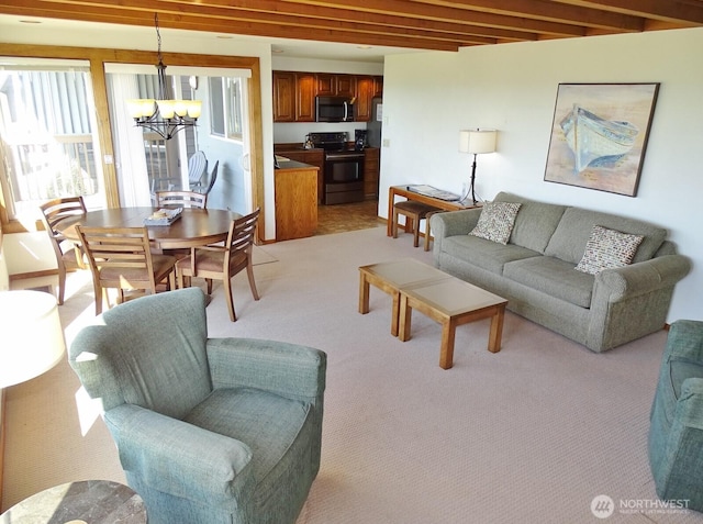 1407 Ocean Shores Blvd SW Unit 1N-I, Ocean Shores, WA 98569 - living area featuring a chandelier, light colored carpet, and beam ceiling