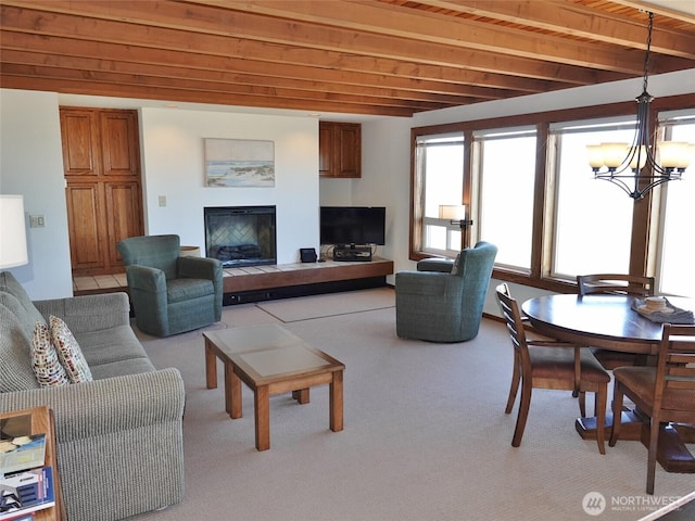 1407 Ocean Shores Blvd SW Unit 1N-I, Ocean Shores, WA 98569 - living room with light carpet, a fireplace, a chandelier, and beam ceiling