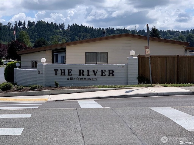 3611 I St NE Unit 291, Auburn, WA 98002 - community sign with a wooded view