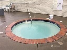 3611 I St NE Unit 291, Auburn, WA 98002 - view of swimming pool with a community hot tub