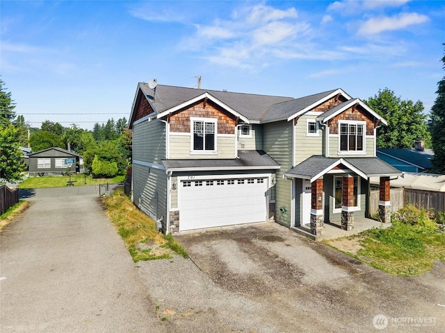 701 Stratford Pl, Sultan, WA 98294 - view of front of house featuring asphalt driveway, a porch, an attached garage, stone siding, and a shingled roof