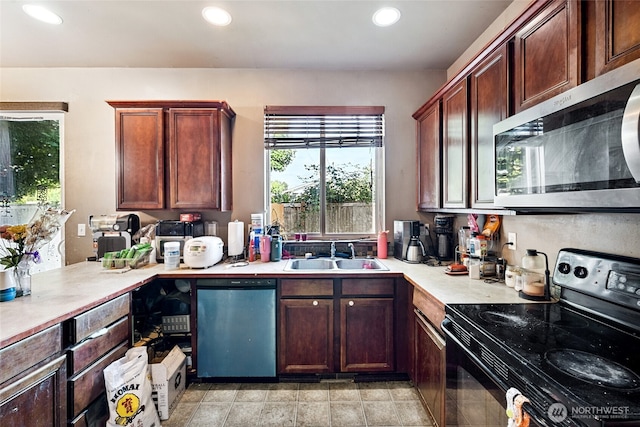 701 Stratford Pl, Sultan, WA 98294 - kitchen featuring appliances with stainless steel finishes, light countertops, and recessed lighting