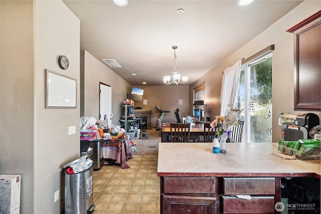 701 Stratford Pl, Sultan, WA 98294 - kitchen featuring a chandelier, light countertops, decorative light fixtures, dark brown cabinetry, and recessed lighting