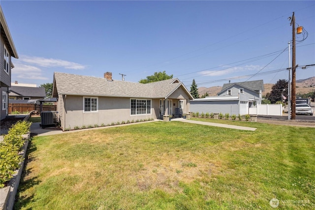 214 S Bradley St, Chelan, WA 98816 - ranch-style home featuring a chimney, stucco siding, and a shingled roof