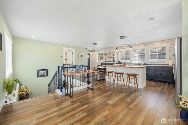 214 S Bradley St, Chelan, WA 98816 - living area featuring dark wood finished floors, healthy amount of natural light, and recessed lighting