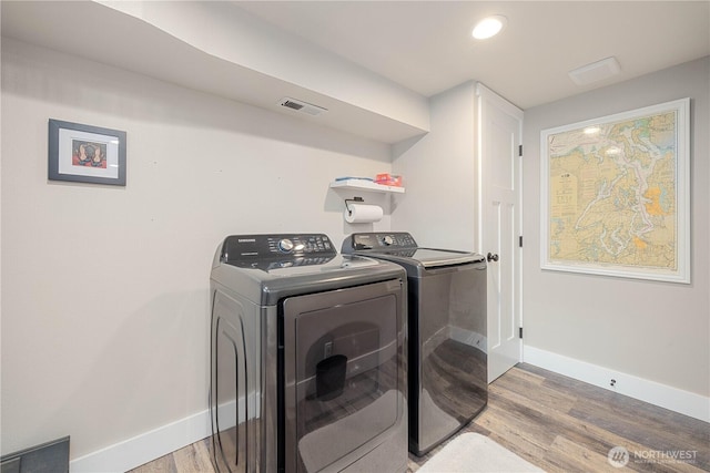 214 S Bradley St, Chelan, WA 98816 - washroom with washer and dryer and light wood-style flooring