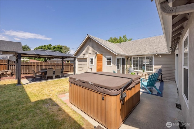 214 S Bradley St, Chelan, WA 98816 - fenced backyard with a hot tub, a patio area, and a gazebo