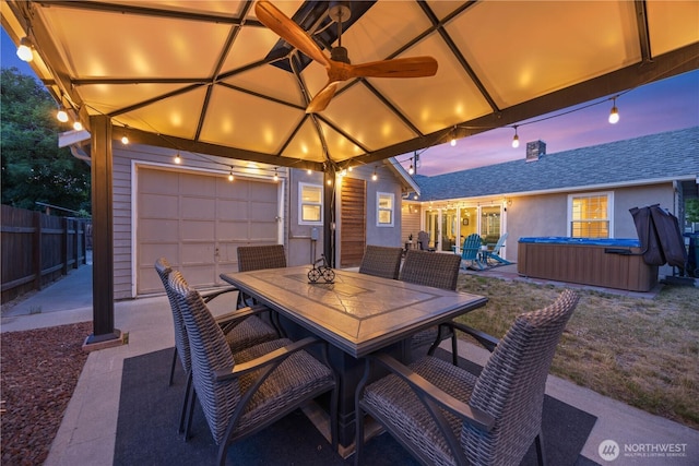 214 S Bradley St, Chelan, WA 98816 - view of patio featuring a hot tub and outdoor dining space