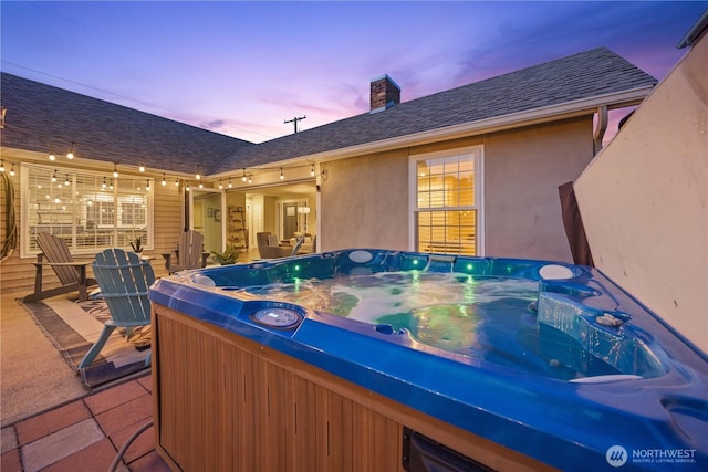 214 S Bradley St, Chelan, WA 98816 - patio terrace at dusk featuring a hot tub