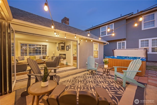 214 S Bradley St, Chelan, WA 98816 - view of patio / terrace featuring a hot tub and outdoor lounge area