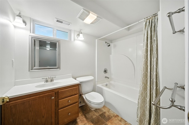 521 S Park St, Walla Walla, WA 99362 - bathroom featuring vanity, shower / bath combo with shower curtain, and stone finish flooring