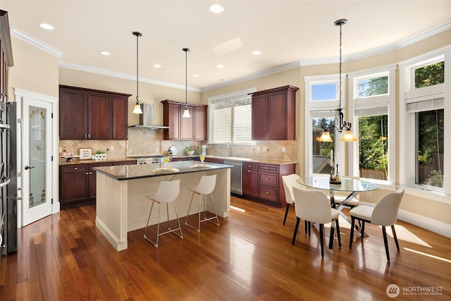 14248 SE Allen Rd, Bellevue, WA 98006 - kitchen with wall chimney range hood, a kitchen island, stainless steel dishwasher, dark wood finished floors, and a breakfast bar area