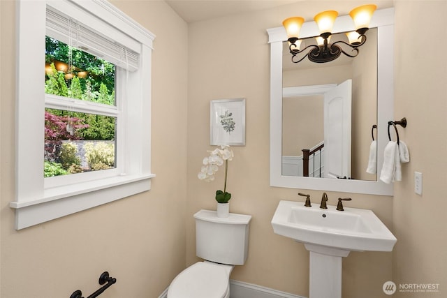 14248 SE Allen Rd, Bellevue, WA 98006 - half bathroom with a chandelier and toilet