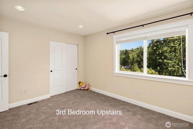 14248 SE Allen Rd, Bellevue, WA 98006 - unfurnished bedroom featuring carpet flooring, recessed lighting, and a closet
