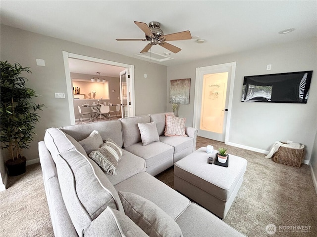 1221 E 63rd St, Tacoma, WA 98404 - carpeted living area featuring a ceiling fan and baseboards