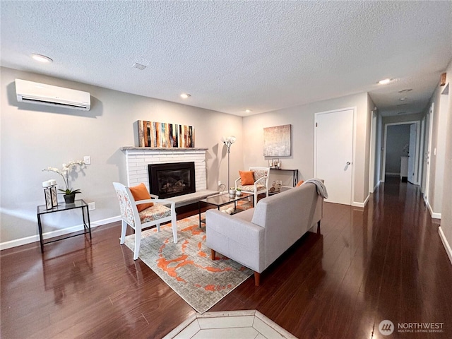 1221 E 63rd St, Tacoma, WA 98404 - living area with an AC wall unit, a textured ceiling, dark wood finished floors, recessed lighting, and a brick fireplace