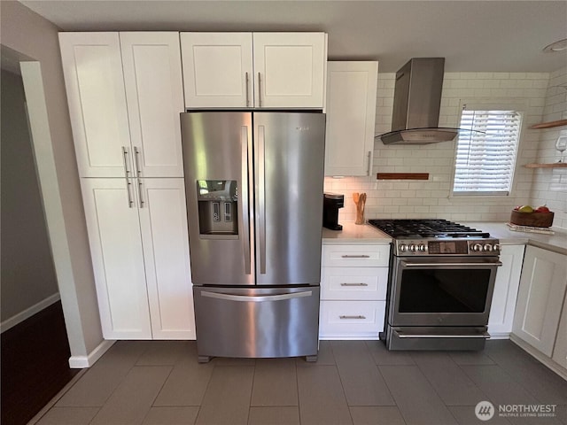 1221 E 63rd St, Tacoma, WA 98404 - kitchen featuring stainless steel appliances, ventilation hood, light countertops, and white cabinets