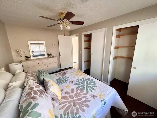 1221 E 63rd St, Tacoma, WA 98404 - bedroom with two closets, a ceiling fan, and a textured ceiling