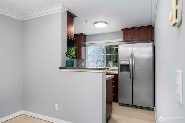 1839 S 286th Ln Unit S-201, Federal Way, WA 98003 - kitchen featuring stainless steel fridge with ice dispenser, ornamental molding, light wood finished floors, and a peninsula