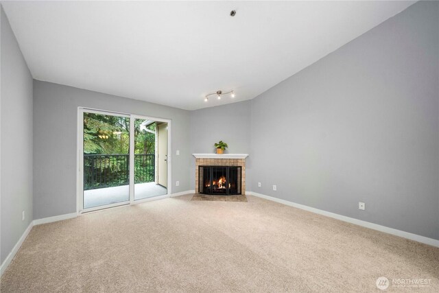 1839 S 286th Ln Unit S-201, Federal Way, WA 98003 - unfurnished living room with carpet and a tile fireplace