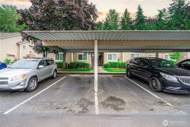 1839 S 286th Ln Unit S-201, Federal Way, WA 98003 - parking at dusk featuring covered parking