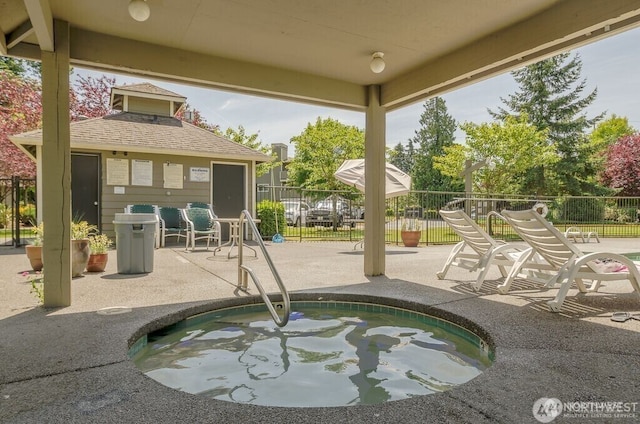 1839 S 286th Ln Unit S-201, Federal Way, WA 98003 - view of swimming pool featuring a patio area, an outdoor structure, and a community hot tub