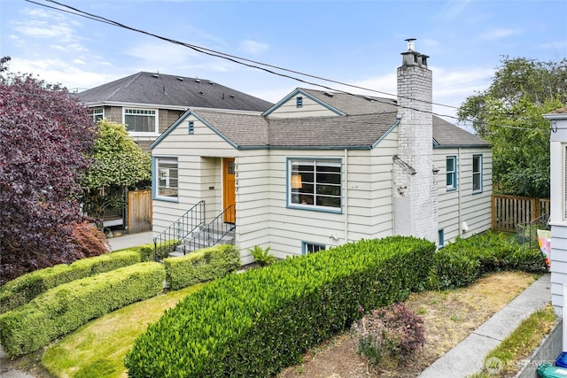 1327 N 79th St, Seattle, WA 98103 - view of front of property featuring a chimney and a shingled roof