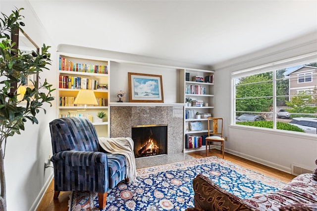 1327 N 79th St, Seattle, WA 98103 - sitting room featuring a high end fireplace and wood finished floors