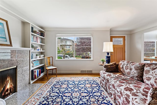 1327 N 79th St, Seattle, WA 98103 - living room with a tiled fireplace and wood finished floors