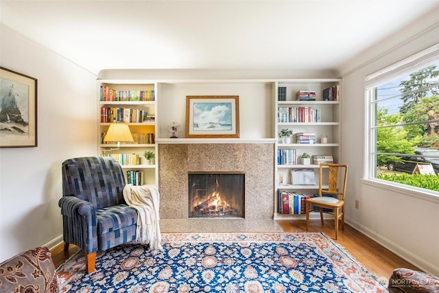 1327 N 79th St, Seattle, WA 98103 - sitting room with a premium fireplace and wood finished floors