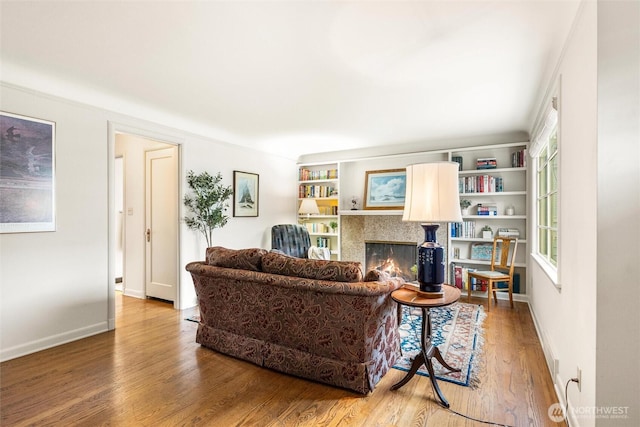 1327 N 79th St, Seattle, WA 98103 - living room with a warm lit fireplace and wood finished floors