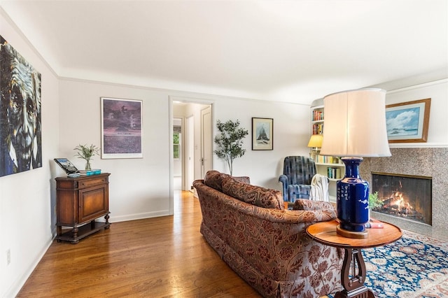 1327 N 79th St, Seattle, WA 98103 - living room featuring wood finished floors and a lit fireplace